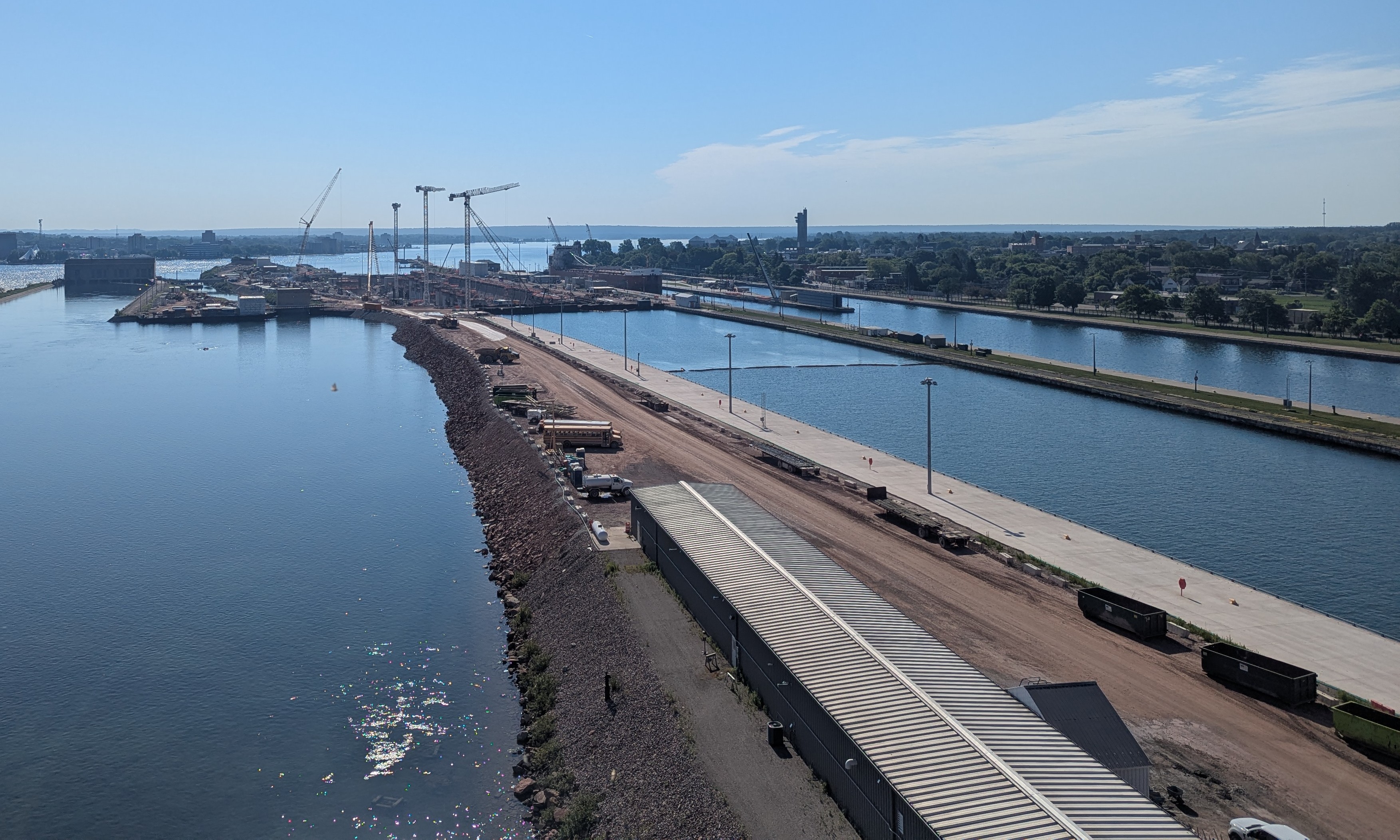 A view of the new soo lock (under construction) from the bridge. Cranes and construction vehicles are visible.